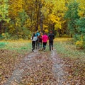 Running athletes in the park on a run in the early morning. Several children are running in the woods doing sports Royalty Free Stock Photo