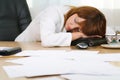 Businesswoman sleeping at her laptop Royalty Free Stock Photo