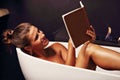 Adult attractive woman relaxing in bath tube Royalty Free Stock Photo