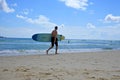 Adult Australian man going to surf in Byron Bay beach New South Wales Australia
