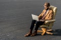 adult bearded businessman sitting in armchair and Royalty Free Stock Photo