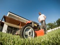 Adult bearded male with lawnmower