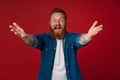 Adult bearded tattooed handsome enthusiastic redhead man with opened arms