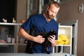 Adult black cat examined by veterinarian in clinic