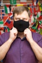 Adult blond man in medical mask against Royalty Free Stock Photo