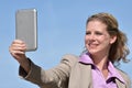 Adult Blonde Business Woman Smiling With Tablet Royalty Free Stock Photo