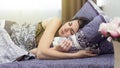 An adult brunette woman sleeps a healthy sound