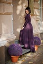 Adult brunette woman at violet gown Royalty Free Stock Photo