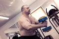 The adult brutal man is engaged in power bodybuilding