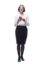 adult business woman with a smartphone looking at you . Royalty Free Stock Photo