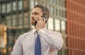 adult businessman call on smartphone outside. photo of businessman call on smartphone and talk.