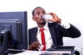 Adult businessman drinking mineral water from plastic bottle in office Royalty Free Stock Photo