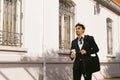 Adult businessman walking down the street on his way to the office with a coffee and his work briefcase Royalty Free Stock Photo