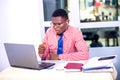 Adult businessman working at laptop in office Royalty Free Stock Photo