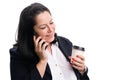 Businesswoman smiling making phonecall holding cup of coffee Royalty Free Stock Photo