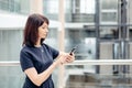 Adult businesswomen in suit using smartphone Royalty Free Stock Photo