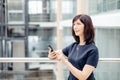 Adult businesswomen in suit using smartphone Royalty Free Stock Photo