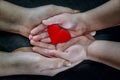 Adult and child hands holding red heart, health care, donate and family insurance concept,world heart day, world health day, CSR c Royalty Free Stock Photo