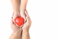 Adult and child hands holding red heart isolated Royalty Free Stock Photo