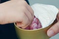 Adult child pink candy treats in powdered sugar from box Royalty Free Stock Photo