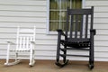 Adult and childs rocking chairs on wood porch Royalty Free Stock Photo