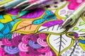 Adult coloring book, new stress relieving trend. Art therapy, mental health, creativity and mindfulness concept. Adult coloring.