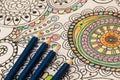 Adult colouring books with pencils, new stress relieving trend, mindfulness concept person coloring illustrative