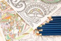 Adult colouring books with pencils, new stress relieving trend, mindfulness concept person coloring illustrative