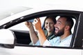 Adult couple choosing new car in showroom Royalty Free Stock Photo