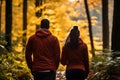 An adult couple on a morning jog in a sunny forest. Healthy lifestyle concept Royalty Free Stock Photo