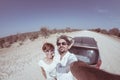 Adult couple selfie on road trip in the desert, Namib Naukluft National Park, travel destination in Namibia, Africa. Fisheye, peop Royalty Free Stock Photo