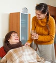 Adult daughter caring for unwell mother