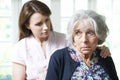 Adult Daughter Consoling Senior Mother At Home Royalty Free Stock Photo