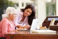 Adult Daughter Helping Mother With Laptop Royalty Free Stock Photo