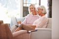 Adult Daughter Helping Senior Mother With Computer At Home Royalty Free Stock Photo