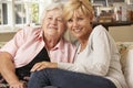 Adult Daughter Visiting Senior Mother Sitting On Sofa At Home Royalty Free Stock Photo