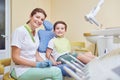 Adult dentist with little patient in hospital office Royalty Free Stock Photo