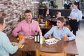 Adult family with teenagers having lunch