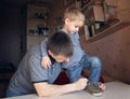 Adult father learning his little son to lace his shoes Royalty Free Stock Photo