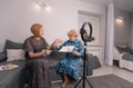 Adult female bloggers conduct live broadcasts and broadcast on social networks. Grandmothers-bloggers communicate on the