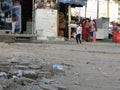 Adult and Female Children Wandering In The Streets