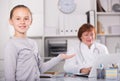 Adult female doctor leading medical appointment Royalty Free Stock Photo