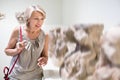 Adult female looking at artwork sculpture in the museum indoors