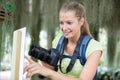 adult female photographer taking shots at tropical park Royalty Free Stock Photo