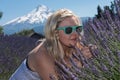An adult female sniffs wild lavender flowers in Oregon. Selective focus for artistic purposes Royalty Free Stock Photo