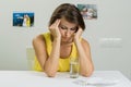 An adult female suffers from a severe headache. She holds her he Royalty Free Stock Photo