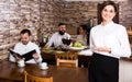 Female waiter showing country restaurant Royalty Free Stock Photo