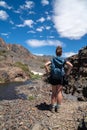 Adult female woman hiker stands on the 20 Lakes Basin trail California