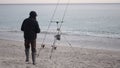 An adult fisherman making adjustments