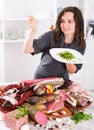 Adult girl prefers to eat greens and salad Royalty Free Stock Photo